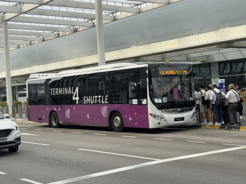 airport shuttle bus outside a terminal