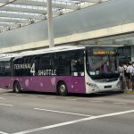 airport shuttle bus outside a terminal